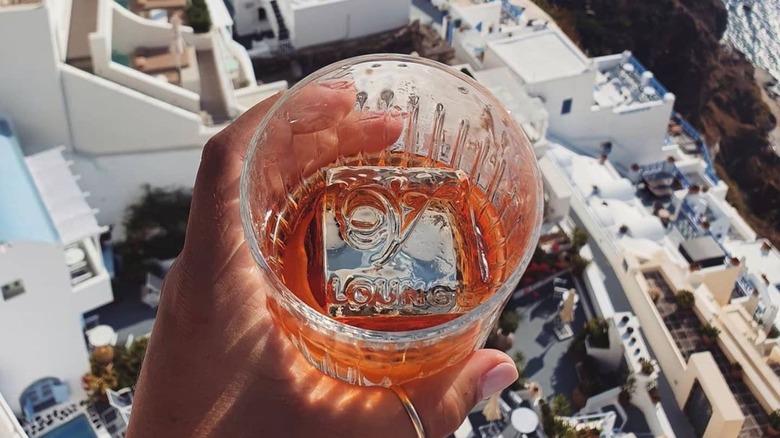 logo stamped into an ice cube in a cocktail