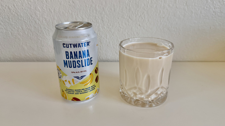 Banana Mudslide can with a full glass next to it