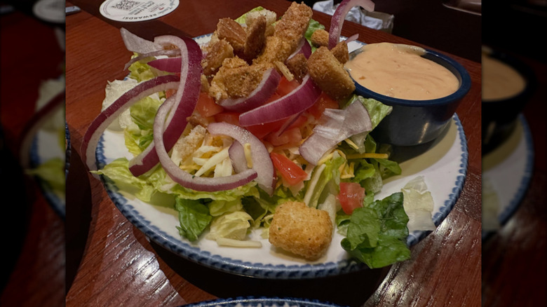 A plate of salad on a table in Red Lobster