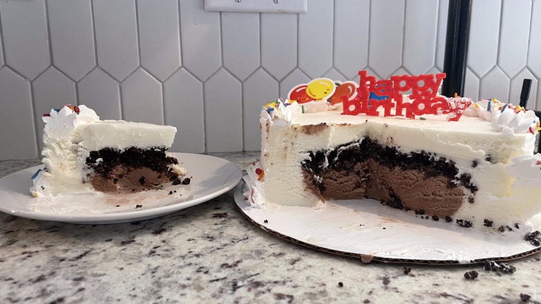 Pulled out slice and whole Dairy Queen Ice Cream cake