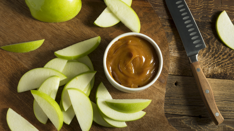 Overhead view of sliced apples on a cutting board