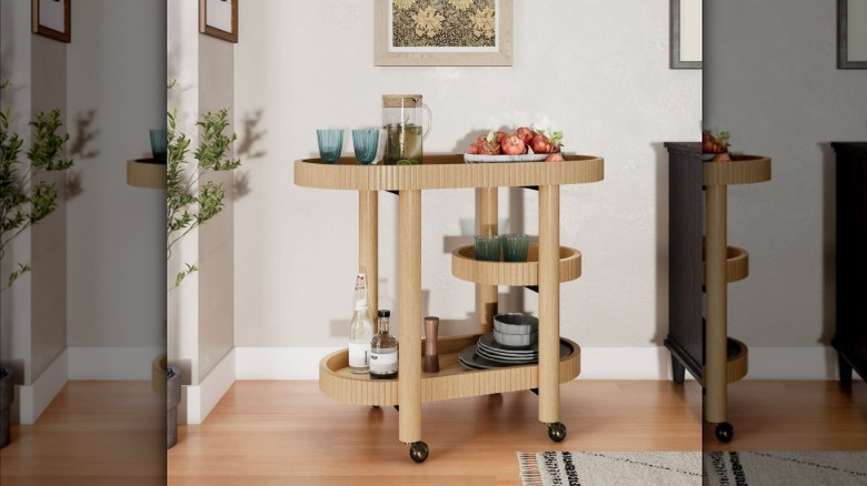 Wooden bar cart with items on it