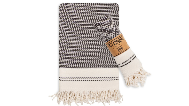Black and cream hand towel set on a white background