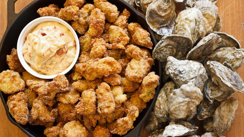 platter of fried oysters next to shells