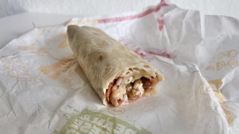 Jack'd Up Beans, Rice, & Cheese Burrito on paper wrapper