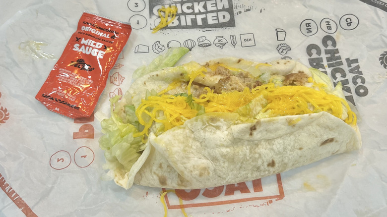 Del Taco Grilled Chicken Taco with sauce on wrapper.
