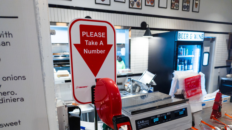 close up of number machine at deli counter