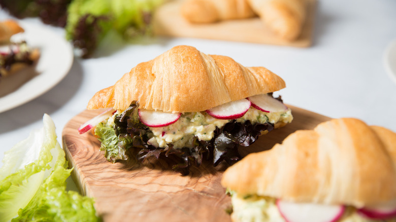 croissant egg sandwiches on table