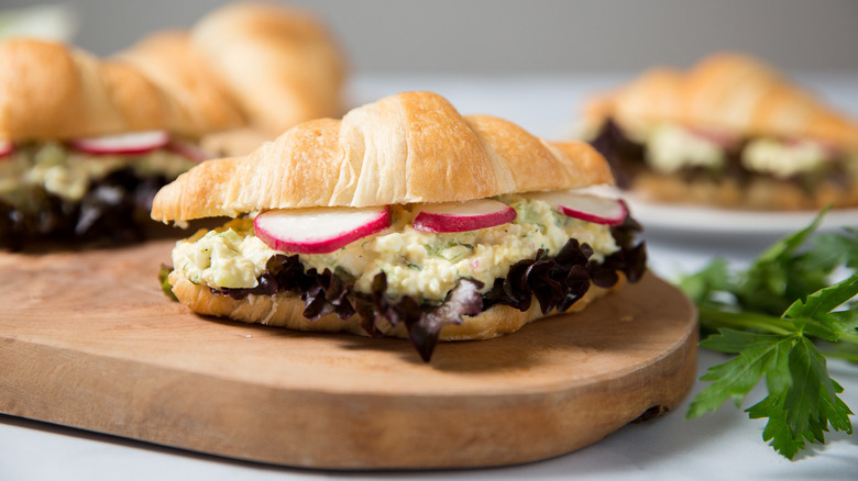 croissant egg sandwiches on table