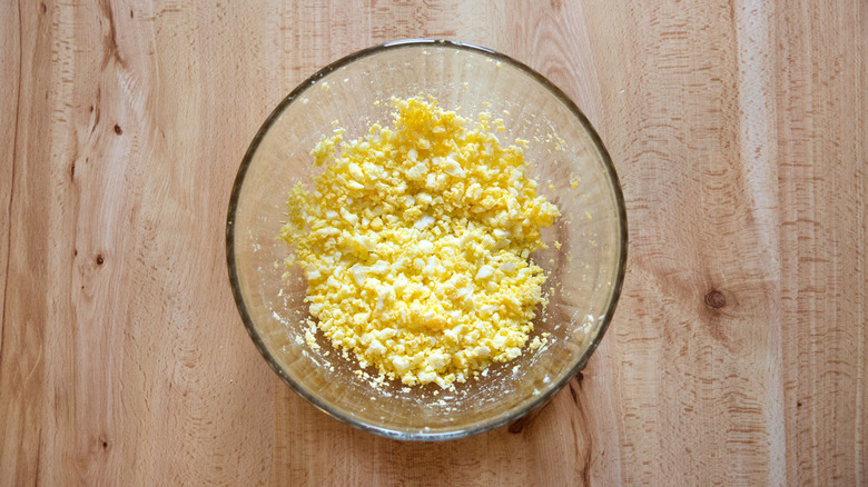 mashed eggs in glass bowl