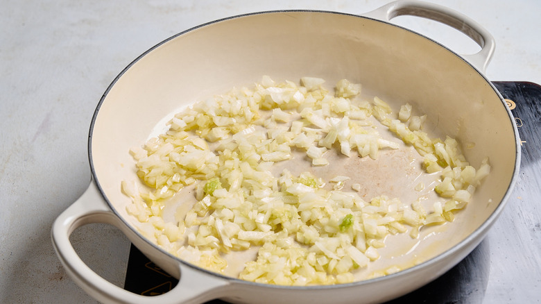 cooking onion and garlic in a skillet
