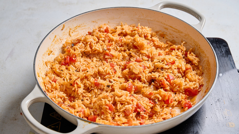 cooking rice in a skillet