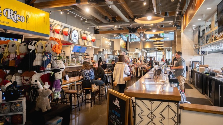 The interior of a food hall with soft lighting