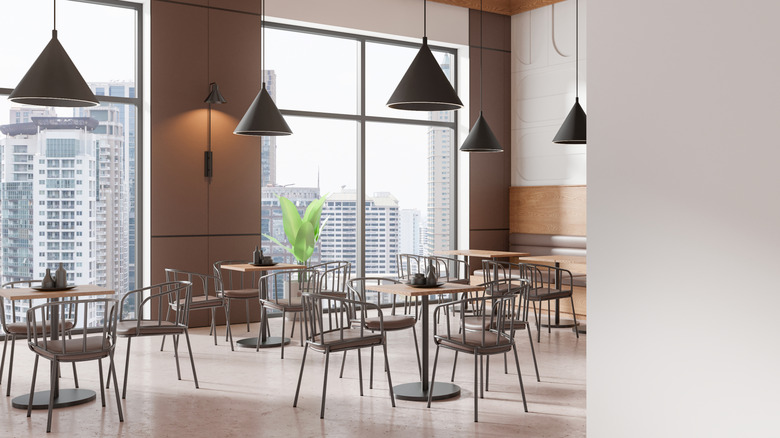 An empty restaurant overlooking a skyline