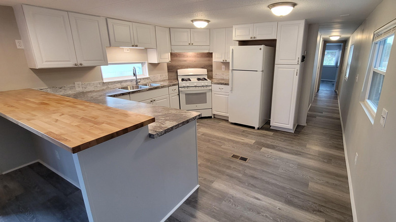 A kitchen with a two-tier peninsula