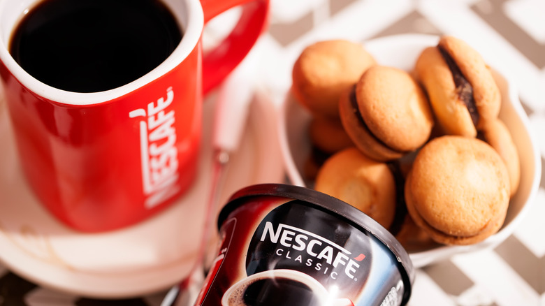 Nestle mug with coffee and cookies