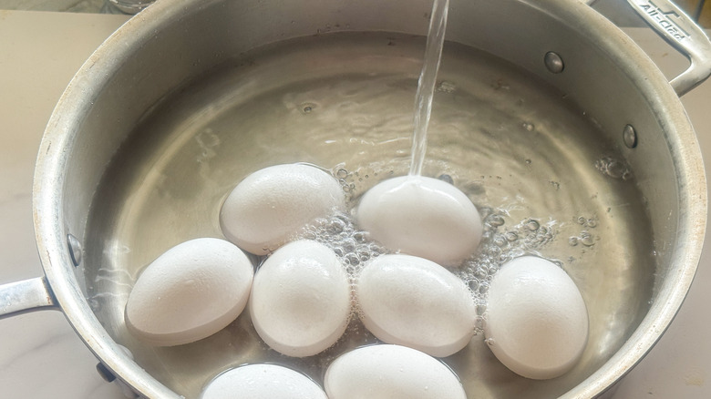 eggs in pan filling up with water