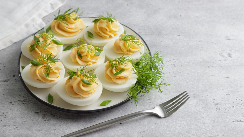 plate of garnished deviled eggs