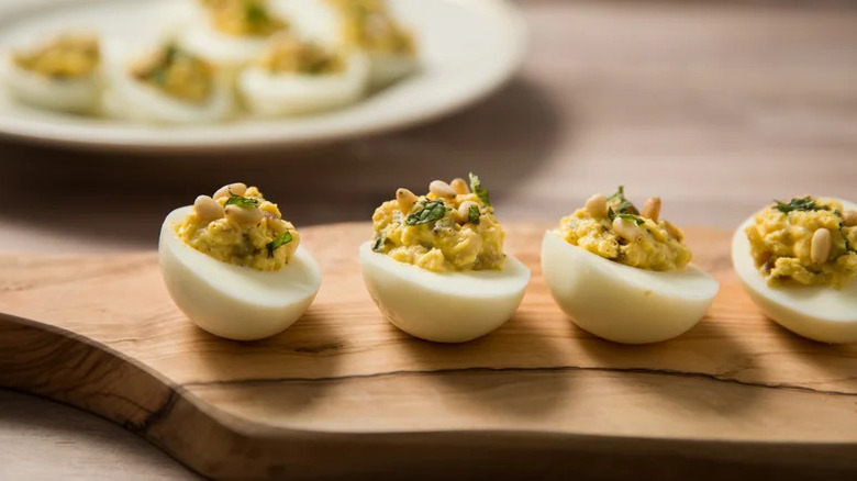 Ancient Rome-Inspired Deviled Eggs on wooden board