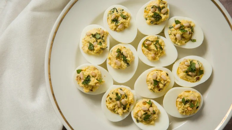 Ancient Roman-inspired deviled eggs on white plate