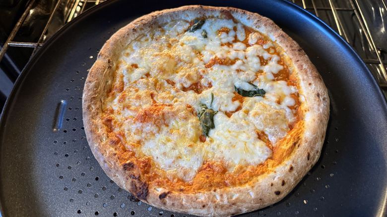 Di Fara Vodka Sauce frozen pizza cooking in oven