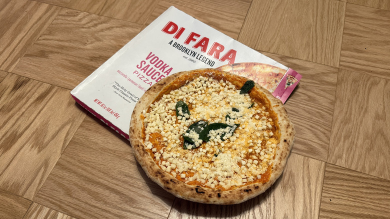 Di Fara Vodka Sauce frozen pizza, uncooked, on top of box