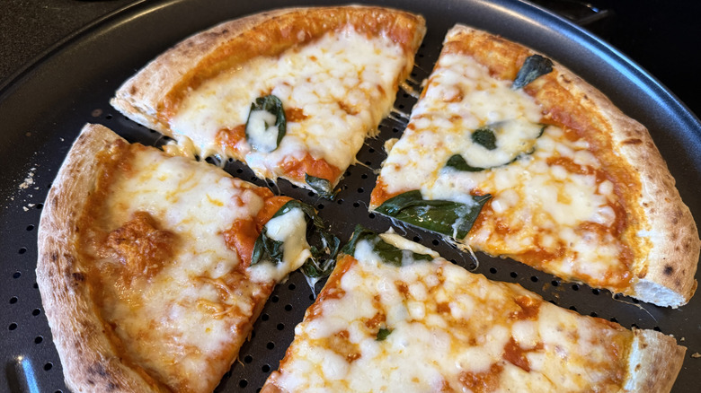 Di Fara Vodka Sauce frozen pizza, cooked and sliced into quarters