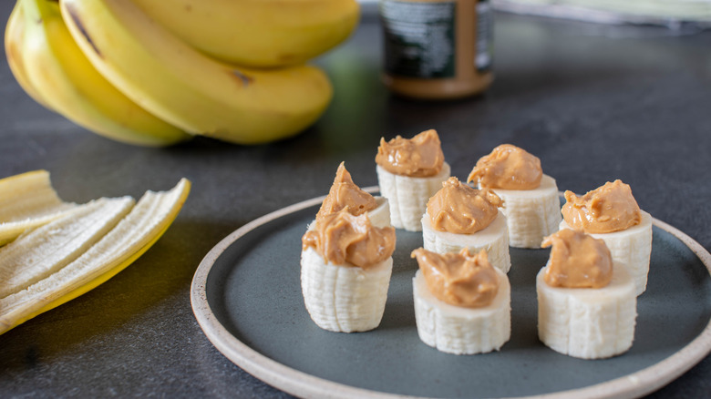 slices of banana topped with peanut butter