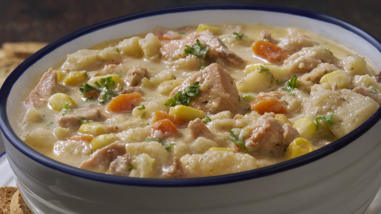 Bowl of creamy fish chowder with salt pork