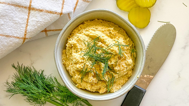 dill pickle hummus in bowl 