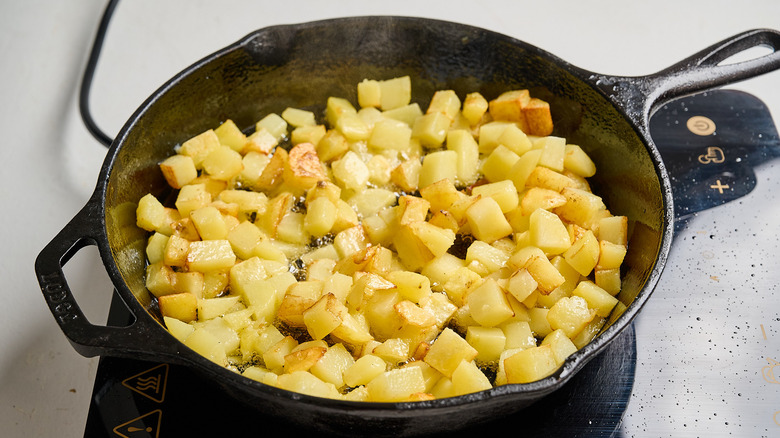 browning potatoes in a skillet