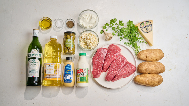 Dirty martini steak frites ingredients on a table