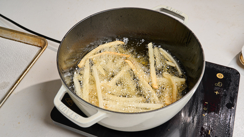 frying french fries in hot oil