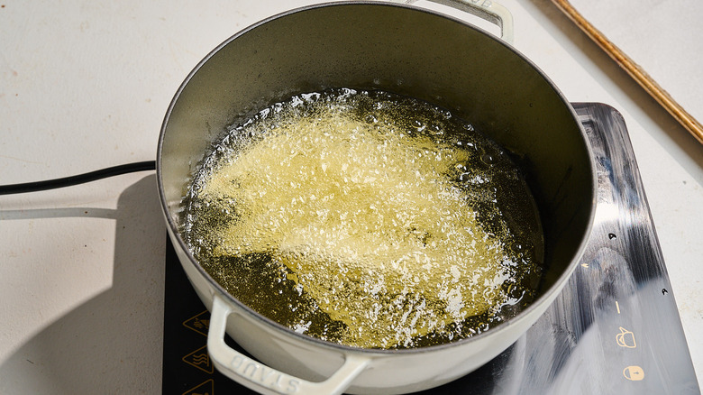 french fries frying in hot oil
