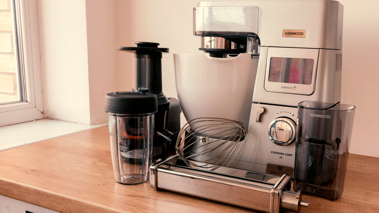 A bulky food processor on a countertop.