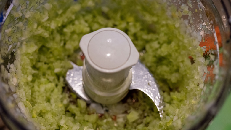 A close-up of sharp blades on a food processor.