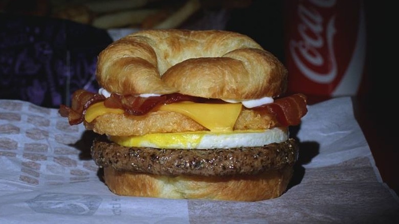 Person opening up a brunch burger from Jack in the Box