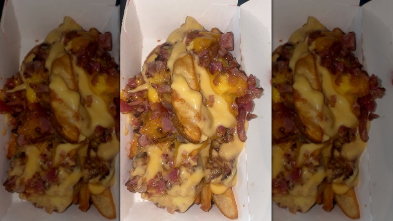 Jack in the Box potato wedges with cheese and other toppings