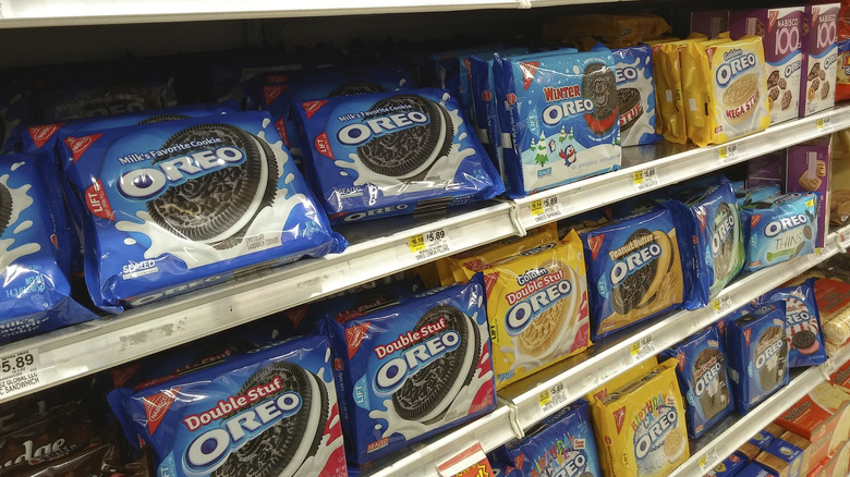 The Oreo section of the cookie aisle with a huge variety of different flavors and types of Oreos on the shelf