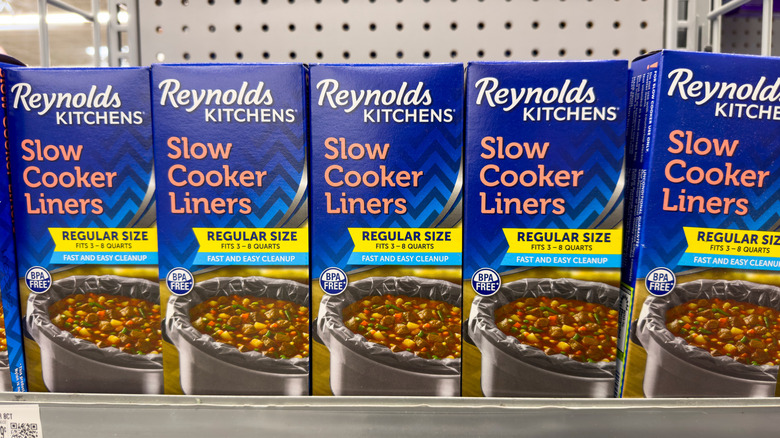 Boxes of plastic Reynolds Slow Cooker Liners on a shelf in a store