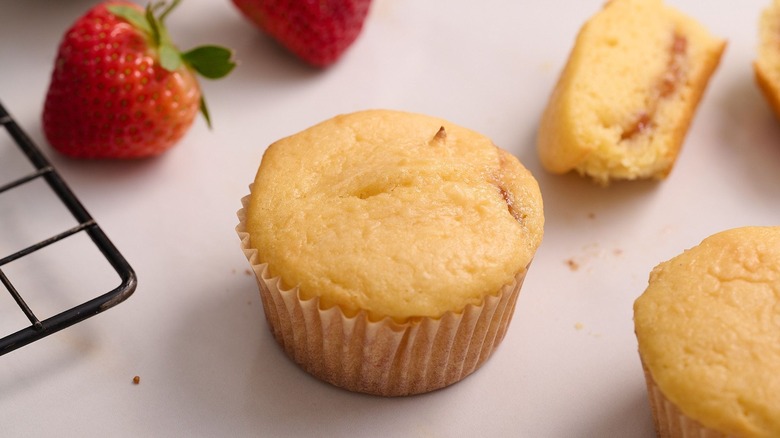 Strawberry muffins next to strawberries
