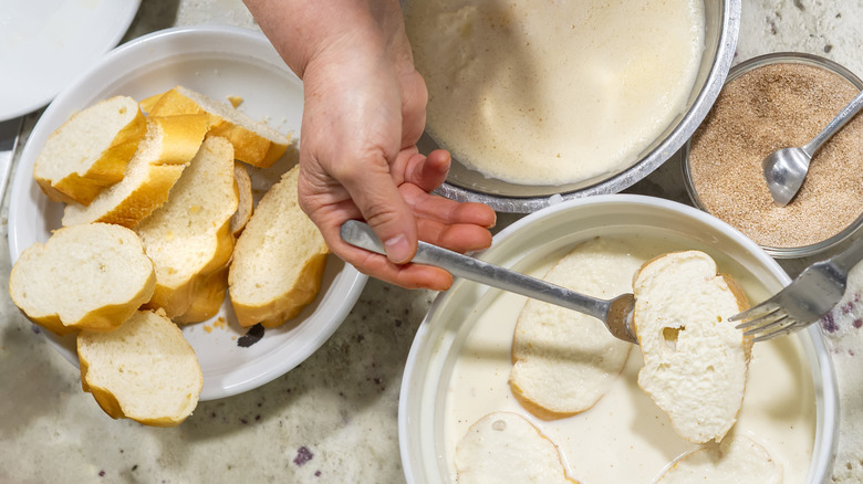 A person making french toast
