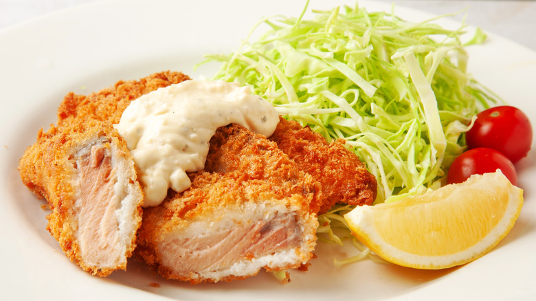 breadcrumb coated deep fried salmon on a plate