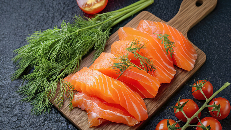 salmon filets on wood board
