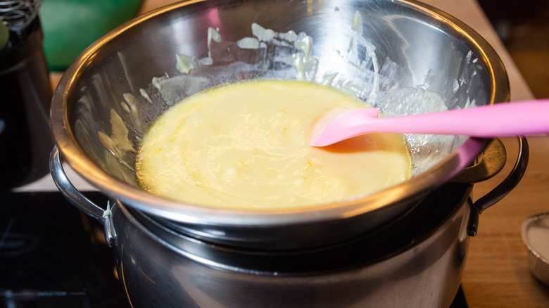 Overhead view of making double-boiler scrambled eggs