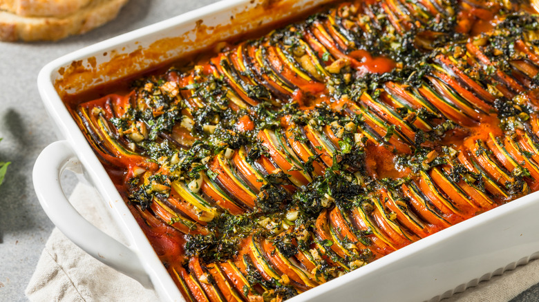 A squash and tomato ratatouille topped with herbs