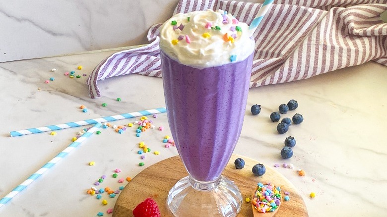 purple milkshake with garnishes