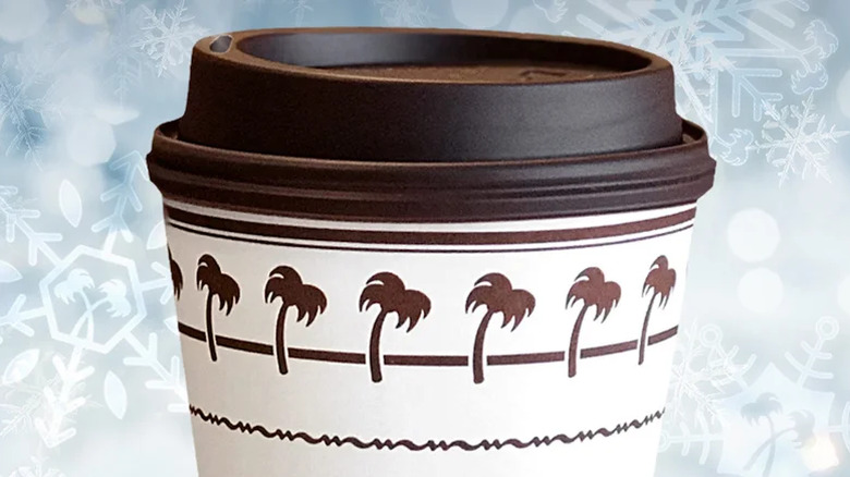 A cup of In-N-Out hot chocolate against an animated background