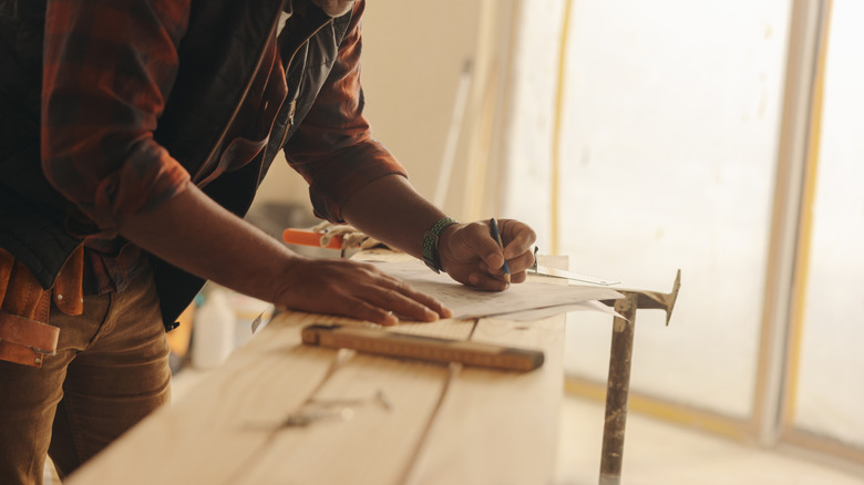 man working on kitchen remodel