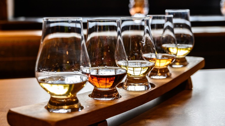 A whiskey tasting flight on a table 